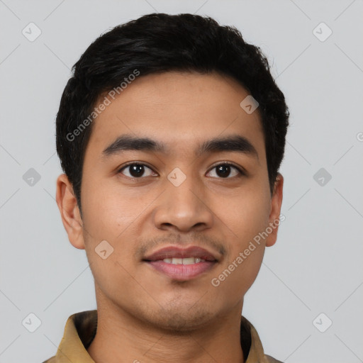 Joyful latino young-adult male with short  black hair and brown eyes