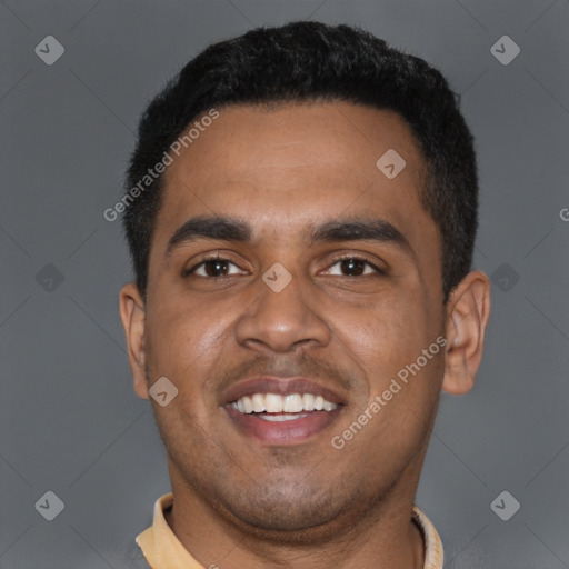 Joyful black young-adult male with short  black hair and brown eyes