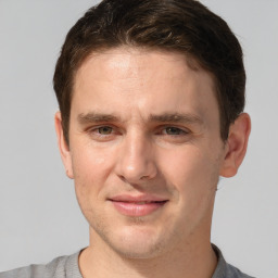 Joyful white adult male with short  brown hair and grey eyes