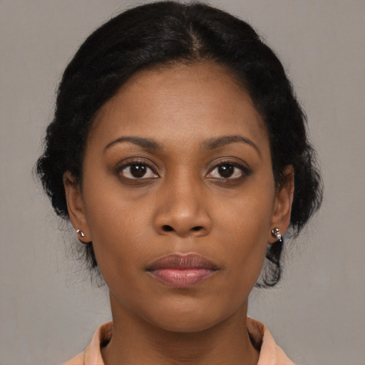 Neutral black young-adult female with medium  brown hair and brown eyes