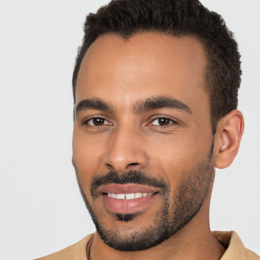 Joyful latino young-adult male with short  black hair and brown eyes