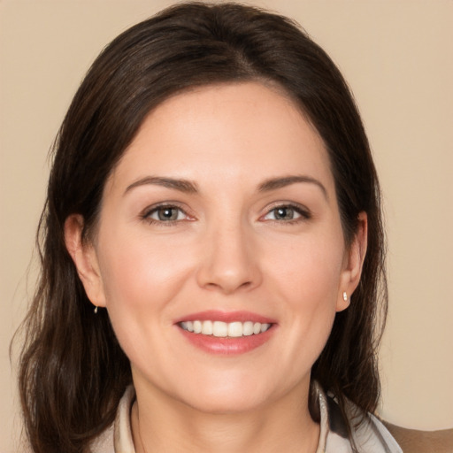 Joyful white young-adult female with medium  brown hair and brown eyes