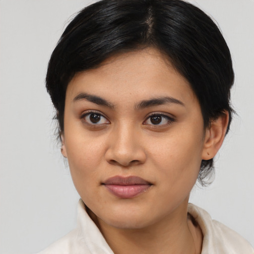 Joyful asian young-adult female with medium  black hair and brown eyes