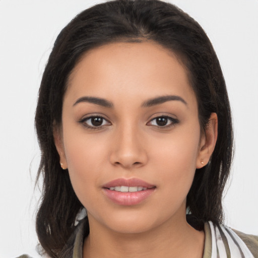 Joyful latino young-adult female with long  brown hair and brown eyes