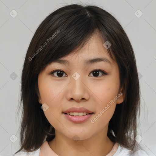 Joyful asian young-adult female with medium  brown hair and brown eyes