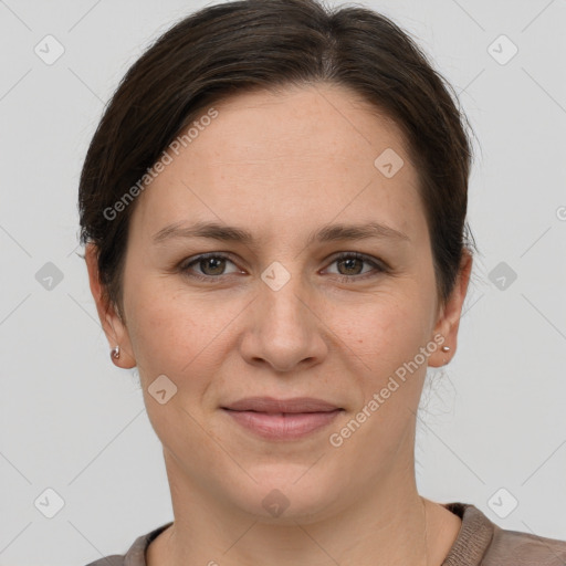 Joyful white adult female with short  brown hair and grey eyes