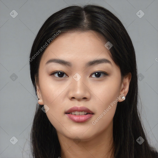 Joyful asian young-adult female with long  black hair and brown eyes