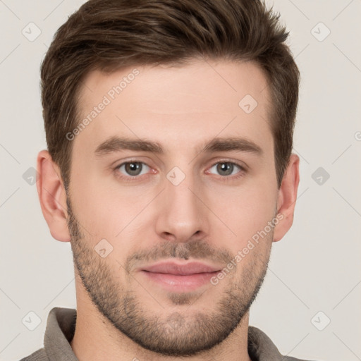 Joyful white young-adult male with short  brown hair and grey eyes