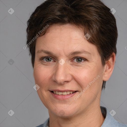 Joyful white adult female with short  brown hair and grey eyes