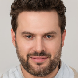 Joyful white adult male with short  brown hair and brown eyes