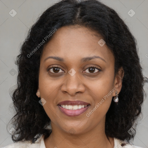 Joyful black young-adult female with medium  brown hair and brown eyes