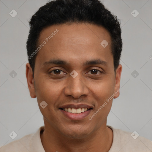 Joyful latino young-adult male with short  black hair and brown eyes