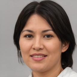 Joyful white adult female with medium  brown hair and brown eyes