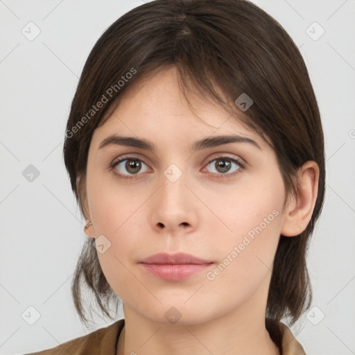 Neutral white young-adult female with medium  brown hair and brown eyes