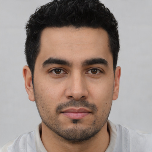 Neutral latino young-adult male with short  black hair and brown eyes
