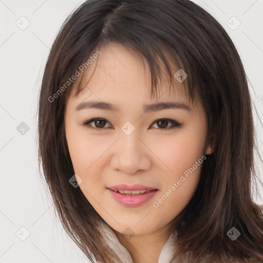 Joyful asian young-adult female with long  brown hair and brown eyes