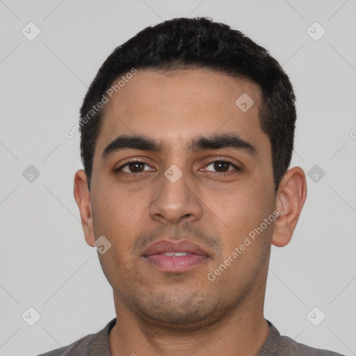 Neutral latino young-adult male with short  black hair and brown eyes