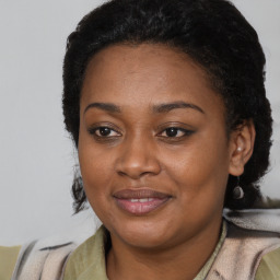Joyful latino young-adult female with short  black hair and brown eyes