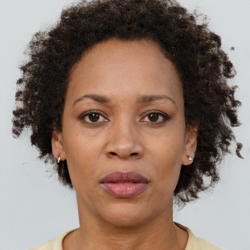 Neutral black adult female with short  brown hair and brown eyes