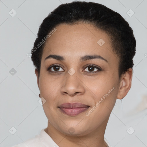 Joyful latino young-adult female with short  black hair and brown eyes