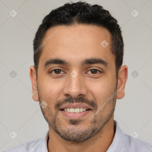 Joyful white young-adult male with short  black hair and brown eyes