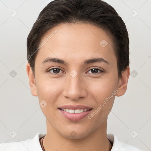 Joyful white young-adult female with short  brown hair and brown eyes