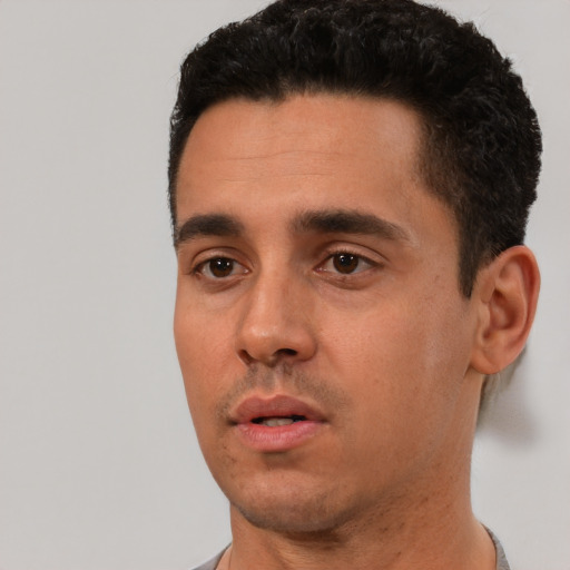 Neutral white young-adult male with short  black hair and brown eyes