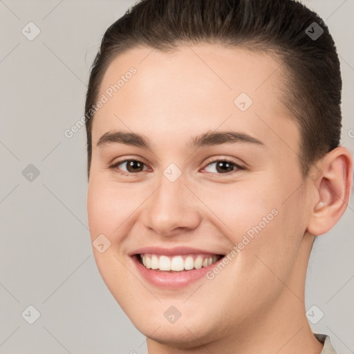 Joyful white young-adult female with short  brown hair and brown eyes