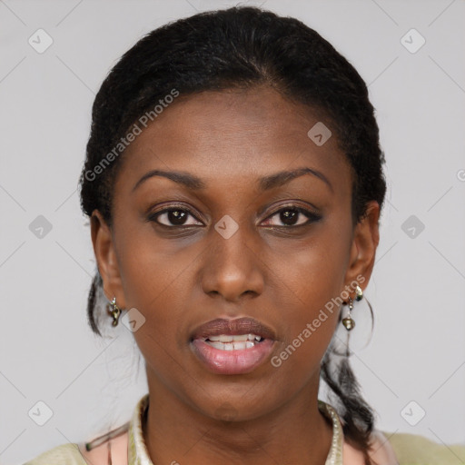 Joyful black young-adult female with short  brown hair and brown eyes