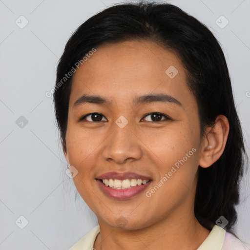 Joyful asian young-adult female with medium  black hair and brown eyes