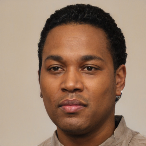 Neutral black young-adult male with short  black hair and brown eyes