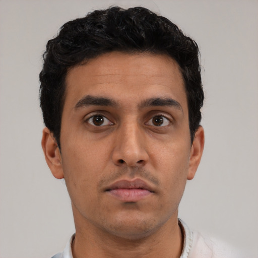 Neutral latino young-adult male with short  brown hair and brown eyes