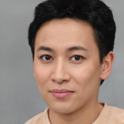 Joyful asian young-adult male with short  black hair and brown eyes