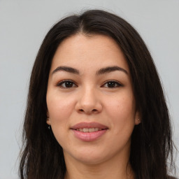 Joyful asian young-adult female with long  brown hair and brown eyes