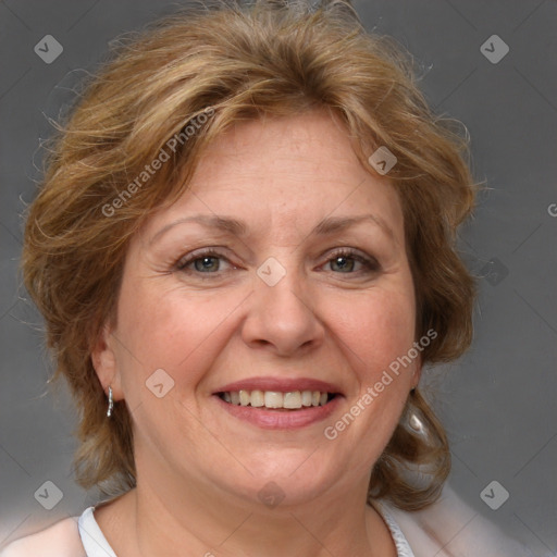 Joyful white adult female with medium  brown hair and blue eyes