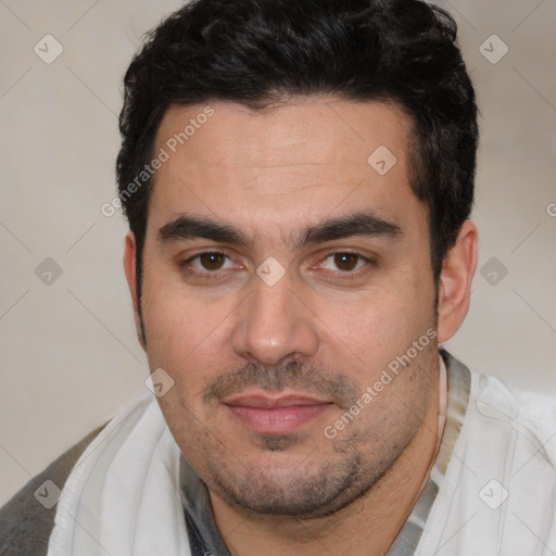 Joyful white young-adult male with short  black hair and brown eyes