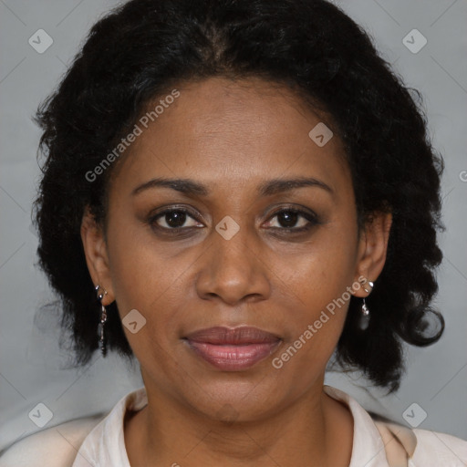 Joyful black adult female with medium  brown hair and brown eyes