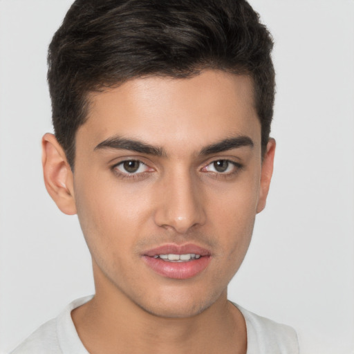 Joyful white young-adult male with short  brown hair and brown eyes