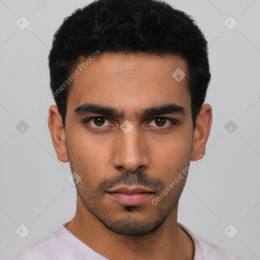 Neutral latino young-adult male with short  black hair and brown eyes