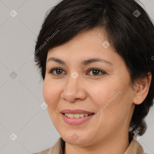 Joyful white adult female with medium  brown hair and brown eyes