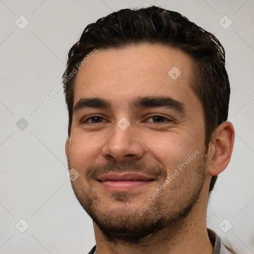 Joyful white young-adult male with short  black hair and brown eyes