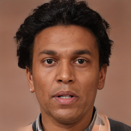 Neutral latino adult male with short  brown hair and brown eyes