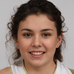 Joyful white child female with medium  brown hair and brown eyes