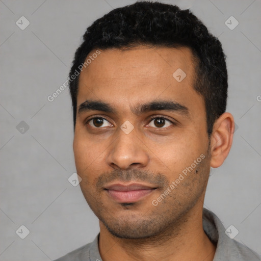 Joyful latino young-adult male with short  black hair and brown eyes