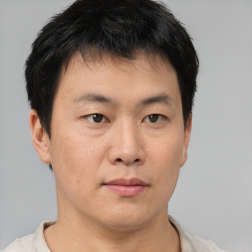 Neutral asian young-adult male with short  brown hair and brown eyes
