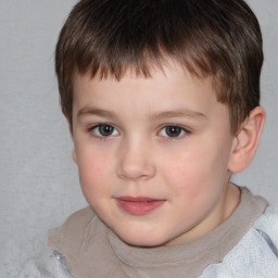 Joyful white child male with short  brown hair and brown eyes