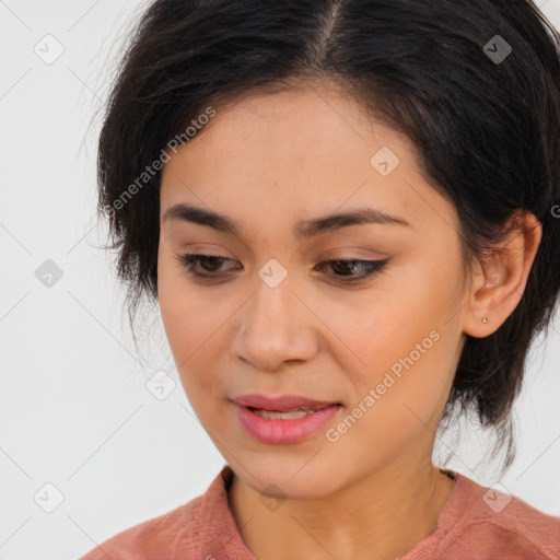 Joyful latino young-adult female with medium  brown hair and brown eyes