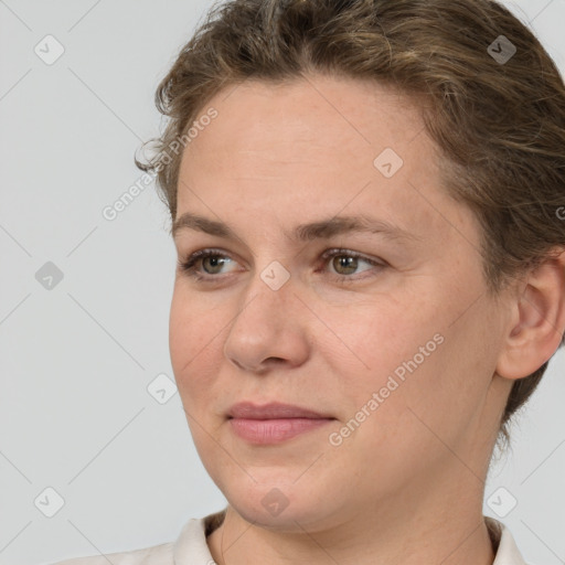 Joyful white adult female with short  brown hair and brown eyes