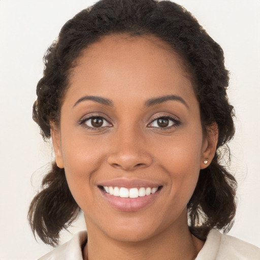 Joyful white young-adult female with long  brown hair and brown eyes