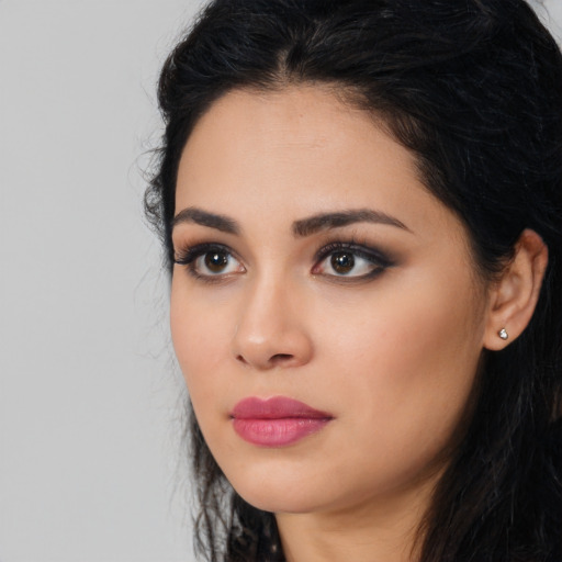 Neutral latino young-adult female with long  black hair and brown eyes